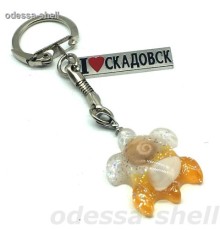 Брелок Скадовскв виде черепашки из пластика внутри натур.ракушка
на хром.фурнит.+металл.табл.опт от2шт разн.цвета
